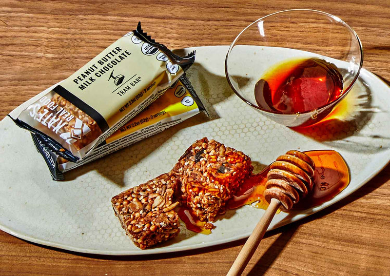 plate of honey and peanut butter milk chocolate oat bars 